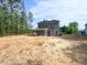 Charming two-story home with spacious backyard and gray siding, awaiting landscaping at 205 Regis Ln # 11, Coats, NC 27521