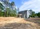 Rear exterior of a charming home, with a spacious yard, awaiting personalized landscaping and outdoor enjoyment at 205 Regis Ln # 11, Coats, NC 27521