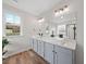 Modern bathroom featuring double vanities and luxurious finishes at 2142 Henderson Tanyard Rd, Pittsboro, NC 27312