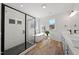 Contemporary bathroom with walk-in shower and soaking tub at 2142 Henderson Tanyard Rd, Pittsboro, NC 27312
