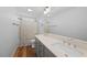 Bright bathroom features a double vanity, neutral walls, and shower/tub combo at 2142 Henderson Tanyard Rd, Pittsboro, NC 27312