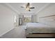 Spacious primary bedroom with neutral tones, plush carpet, and lots of natural light at 2142 Henderson Tanyard Rd, Pittsboro, NC 27312