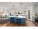 Charming kitchen island with seating and marble countertops at 2142 Henderson Tanyard Rd, Pittsboro, NC 27312