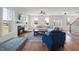 Comfortable living room with plush seating, fireplace, and lots of natural light at 2142 Henderson Tanyard Rd, Pittsboro, NC 27312