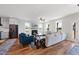 Spacious living room with fireplace, comfortable seating, and an open layout to the kitchen and dining areas at 2142 Henderson Tanyard Rd, Pittsboro, NC 27312
