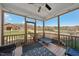 Screened porch offers views of the property, has string lights and a ceiling fan to keep cool in the summer at 2142 Henderson Tanyard Rd, Pittsboro, NC 27312