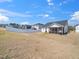 Spacious backyard with privacy fence and views of the surrounding neighborhood at 217 Mallard Loop Dr, Clayton, NC 27527