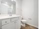 Well-lit bathroom with a vanity, toilet, and shower-tub combination, featuring modern fixtures at 217 Mallard Loop Dr, Clayton, NC 27527