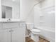 Bright bathroom featuring vanity, toilet, and bathtub with shower featuring modern fixtures at 217 Mallard Loop Dr, Clayton, NC 27527