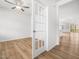 Bedroom with wood floors connected by a glass paneled door to the rest of the home at 217 Mallard Loop Dr, Clayton, NC 27527