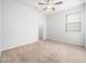 Bright bedroom with a ceiling fan, neutral carpet, and natural light from a window at 217 Mallard Loop Dr, Clayton, NC 27527