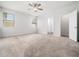 Spacious bedroom featuring plush carpet, large windows, and ample natural light at 217 Mallard Loop Dr, Clayton, NC 27527
