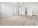 Large bedroom with ceiling fan, plush carpet, and an ensuite bathroom at 217 Mallard Loop Dr, Clayton, NC 27527