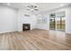 Bright living room features a fireplace and sliding glass doors at 217 Mallard Loop Dr, Clayton, NC 27527