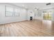 Open concept living room with windows and a modern fireplace at 217 Mallard Loop Dr, Clayton, NC 27527