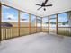 Relaxing screened porch with ceiling fan and views of the backyard at 217 Mallard Loop Dr, Clayton, NC 27527