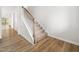 A carpeted staircase with wooden handrails, complemented by wood flooring, connecting different levels at 217 Mallard Loop Dr, Clayton, NC 27527