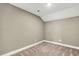 Carpeted attic space featuring neutral walls and an electrical outlet at 220 Shawnee Dr, Louisburg, NC 27549