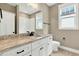 Bathroom featuring granite counters, white cabinets and subway tile shower at 220 Shawnee Dr, Louisburg, NC 27549