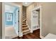 Entryway featuring a staircase, bench with storage and views into a bedroom at 220 Shawnee Dr, Louisburg, NC 27549