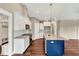 Kitchen boasts white cabinets, stainless steel appliances, and a stylish island at 220 Shawnee Dr, Louisburg, NC 27549