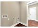Functional laundry room with connections for appliances and neutral colored walls at 220 Shawnee Dr, Louisburg, NC 27549