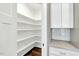 Walk-in pantry with ample shelving and counter space for storage at 220 Shawnee Dr, Louisburg, NC 27549