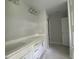 A bathroom boasts a double sink vanity with white cabinets at 226 Rolling Pasture Way, Sanford, NC 27332