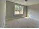 Bright bedroom with a large window, neutral walls, and carpeted floors at 226 Rolling Pasture Way, Sanford, NC 27332