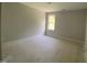 A light filled bedroom with a window at 226 Rolling Pasture Way, Sanford, NC 27332