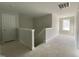 Hallway with access to upstairs rooms. Neutral paint, window and an open view at 226 Rolling Pasture Way, Sanford, NC 27332