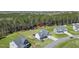 An aerial view of a suburban home with a large, green backyard and lush tree line at 236 Star Valley Dr, Angier, NC 27501