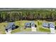 An aerial view of a suburban home with a large, green backyard and lush tree line at 236 Star Valley Dr, Angier, NC 27501