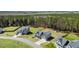 An aerial view of a suburban home with a large, green backyard and lush tree line at 236 Star Valley Dr, Angier, NC 27501