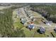 An aerial view of a suburban neighborhood with a large tree line surrounding it at 236 Star Valley Dr, Angier, NC 27501