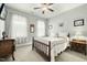 Cozy bedroom with a wood-framed bed, neutral walls, and a ceiling fan at 236 Star Valley Dr, Angier, NC 27501