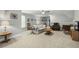 Expansive bonus room offering comfortable seating, a TV, and cozy lighting at 236 Star Valley Dr, Angier, NC 27501