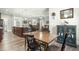 Open dining area with wood floors, view of the kitchen, living room, and detailed cabinet at 236 Star Valley Dr, Angier, NC 27501