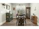 Bright dining area with wood floors, a decorative cabinet, and large windows at 236 Star Valley Dr, Angier, NC 27501