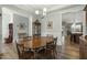 Dining room with wood floors, wainscoting, and chandelier at 236 Star Valley Dr, Angier, NC 27501