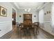 Formal dining room with wainscoting, wood floors, and a chandelier at 236 Star Valley Dr, Angier, NC 27501