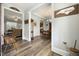 Hallway leading to the living and dining areas with beautiful hardwood floors at 236 Star Valley Dr, Angier, NC 27501