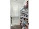 Walk-in pantry with ample shelving for organized storage and easy access at 236 Star Valley Dr, Angier, NC 27501