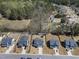 Neighborhood aerial view showcasing manicured lawns, mature trees, and an inviting community pool at 239 Hopper Cir, Clayton, NC 27520