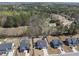 Aerial view of homes showing well-maintained lawns, backyard features and tree-lined streets at 239 Hopper Cir, Clayton, NC 27520