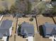 Aerial view of a fenced backyard, featuring a shed, playset, and trampoline at 239 Hopper Cir, Clayton, NC 27520