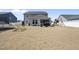 Expansive backyard with play equipment including a trampoline and playset on a sunny day at 239 Hopper Cir, Clayton, NC 27520