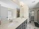 Elegant bathroom featuring double sinks, modern vanity, and a large mirror, offering both style and functionality at 239 Hopper Cir, Clayton, NC 27520