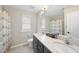 Bathroom with a double sink vanity, tiled floors, and a shower-tub combination at 239 Hopper Cir, Clayton, NC 27520