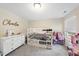 Bedroom with a bunk bed, dresser, and clothing rack at 239 Hopper Cir, Clayton, NC 27520